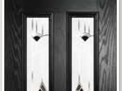 Black composite front door with decorative glazed panels